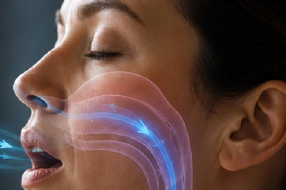 Woman breathing in through her mouth